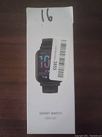 Front view of the retail box showing the smart watch image and product name Model S18, with labeling stickers.