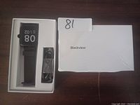 Blackview smart watch in packaging with charging cable and manual boxed separately.