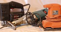 Photo showing Craftsman Sabre Saw, Makita reciprocating saw, and Black & Decker dual-action sander