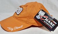 Orange NASCAR ball cap with embroidered '20' and Tony Stewart signature on bill with original Chase Authentics tag attached.