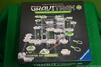 Box front of Gravitrax Pro Vertical Starter Set showing assembled vertical marble track system and packaging branding
