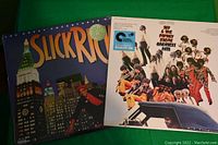 Front covers of Slick Rick's 'The Great Adventures' album and Sly and the Family Stone's 'Greatest Hits' album shown together on a green background.