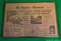 Full view of framed Halifax Chronicle newspaper dated Oct 2, 1943, highlighting headlines and layout.