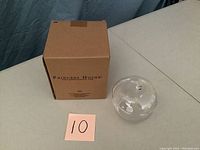 Two-piece crystal candy dish with a box and a handwritten sticker with the number 10.