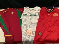 Front view of Portugal, Mexico, and Spain national soccer jerseys together