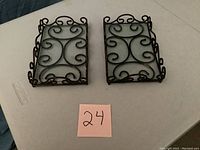 Two Princess House Meridian vanity trays placed side by side, showing the metal scroll design and glass bottoms.