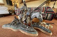 Overview of both sculptures on green marble and wood bases