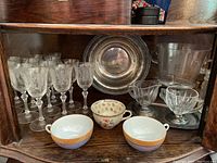 Twelve etched filigree stem glasses, three teacups, silver platter, silver tray, creamer, sugar bowl, ice bucket