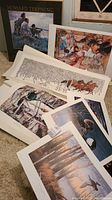Photo showing several art prints including the framed 'Howard Terpning' print, unframed prints featuring horses, Native American figures, and nature scenes.