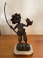 Front view of full bronze sculpture on marble base