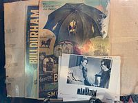 Vintage Bull Durham smoking tobacco posters showing wear, water damage, and mildew.