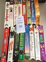 Lot of 16 adult VHS movie tapes in original cases shown with titles and cover art