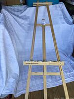 Full view of tall wooden easel showing height and structure