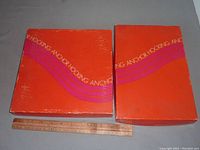 Two orange Anchor Hocking boxes showing brand and style