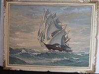 View of framed paint by number painting of a two-masted sailing ship at sea during a cloudy sky, showing overall condition and colors.