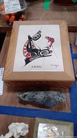 Overview photo of both items: the wooden box with tile top artwork and the soapstone bird carving in front of it.