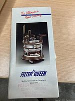 Brochure or manual showing Filter Queen vacuum with slogan 'The Ultimate in Home Cleaning'
