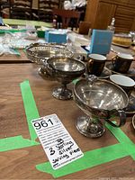 Group shot of all three sterling silver pieces on wood surface, showing overall dimensions and finish