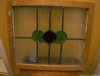 Full view of the vintage leaded glass window with wood frame, showing overall condition and design.