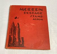 Front cover of red cloth hardcover with black printed text and graphics