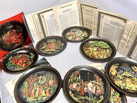 Seven Bradford Exchange Russian Legend Collection plates showing detailed colorful folk scenes with certificates and descriptive sheets behind them.