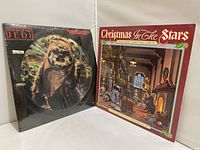 Two Star Wars LPs displayed side by side: Return of the Jedi picture disc and Christmas In The Stars album