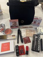 All makeup items alongside black Giorgio Armani makeup pouch