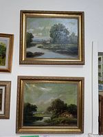 Wall view of both paintings showing overall lot contents