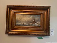 Full view of framed oil painting showing winter landscape and tag