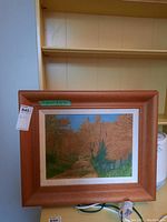 Framed fall landscape painting showing trees and a dirt path, with artist signature 'B. Morris' visible at bottom left.