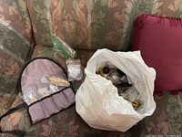 Overview of all items including tool pouch, hardware bag, and miscellaneous pieces on couch