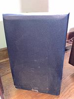 Front view of Infinity PS-8 subwoofer with black grille