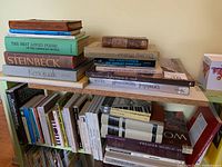 Bookshelves with assorted books on art, music, and literature.