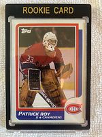 Front of the 1986-87 Topps Patrick Roy rookie card inside a magnetic toploader showing player in goalie gear for Montreal Canadiens, with visible corners and color.