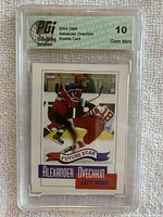 Front side of the 2004 OMR Alexander Ovechkin rookie hockey card showing player in action with red, white and blue uniform and PGI 10 Gem Mint grade label.