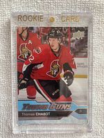 Front view of 2016-17 Upper Deck #488 Thomas Chabot Young Guns Rookie Card in clear magnetic holder labeled 'Rookie Card'