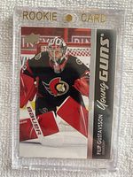 Front side of the Filip Gustavsson Young Guns rookie card showing the player in full goalie stance wearing Ottawa Senators gear.