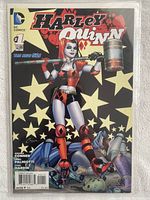 Front cover of Harley Quinn Vol. 2 (2014) #1 comic book showing Harley Quinn holding a mallet with stars in the background. The comic is sealed in a protective sleeve.