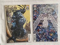 Photo showing both Venom #35 comics side by side, highlighting different variant covers