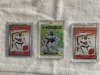 Three hockey cards featuring Spencer Knight in Florida Panthers gear in protective sleeves, arranged horizontally for clear view.
