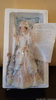 Mrs Albee porcelain doll in original styrofoam packaging with certificate and accessories