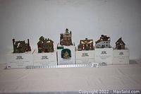 All six houses displayed on original Department 56 boxes with measuring ruler