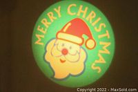 Close-up image of the projected colorful Merry Christmas Santa Claus image.