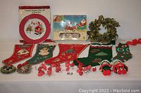 Full display of all vintage Christmas items including stockings, wreaths, Santa lights, and decorative items.