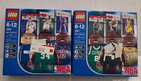 Front view of two Lego Sports NBA Collectors sealed boxes, set numbers 3561 and 3565, showing player minifigure illustrations and packaging details.