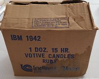 Original cardboard box labeled 'IBM 1942 1 Doz. 15 Hr. Votive Candles Ruby Indiana Glass'