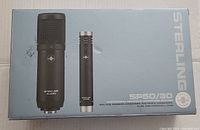 Box front showing Sterling Audio branding and SP50/30 model numbers with images of the two microphones.