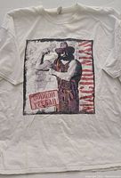 Front view of white t-shirt with Macho Man graphic print and text 'Pooogah Yeeah'