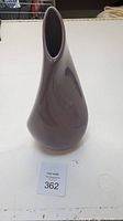 Front view of the vintage purple ceramic Pick N Do vase, teardrop-shaped with narrow oval top opening.
