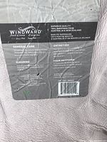 Windward brand tag indicating 100% sheepskin from Australia & New Zealand, care instructions